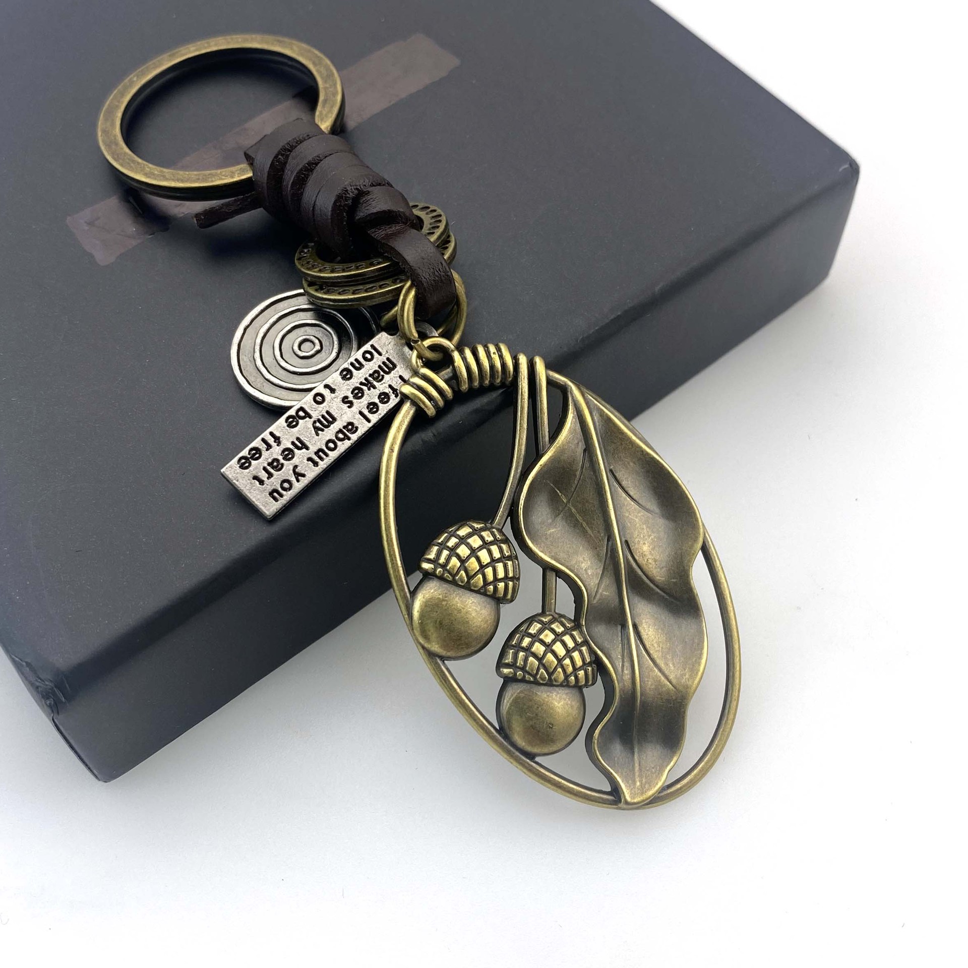 Picture of Cross-border New Hand-woven Retro Kraft Fruit Cotyledon Keychain Tourist Area Gift Gift Bag Hanging Ornaments