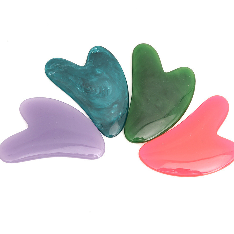Picture of Manufacturer's Wholesale Resin Heart-Shaped Gua Sha Tools for Massaging the Back, Neck, Waist, and Full Body Meridians, Made of Natural Materials