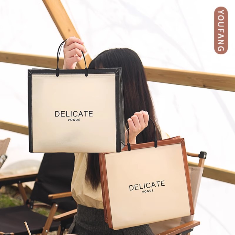 New big-name ear-inserted handbag coated clothing store clothes bag packaging waterproof non-woven fabric logo