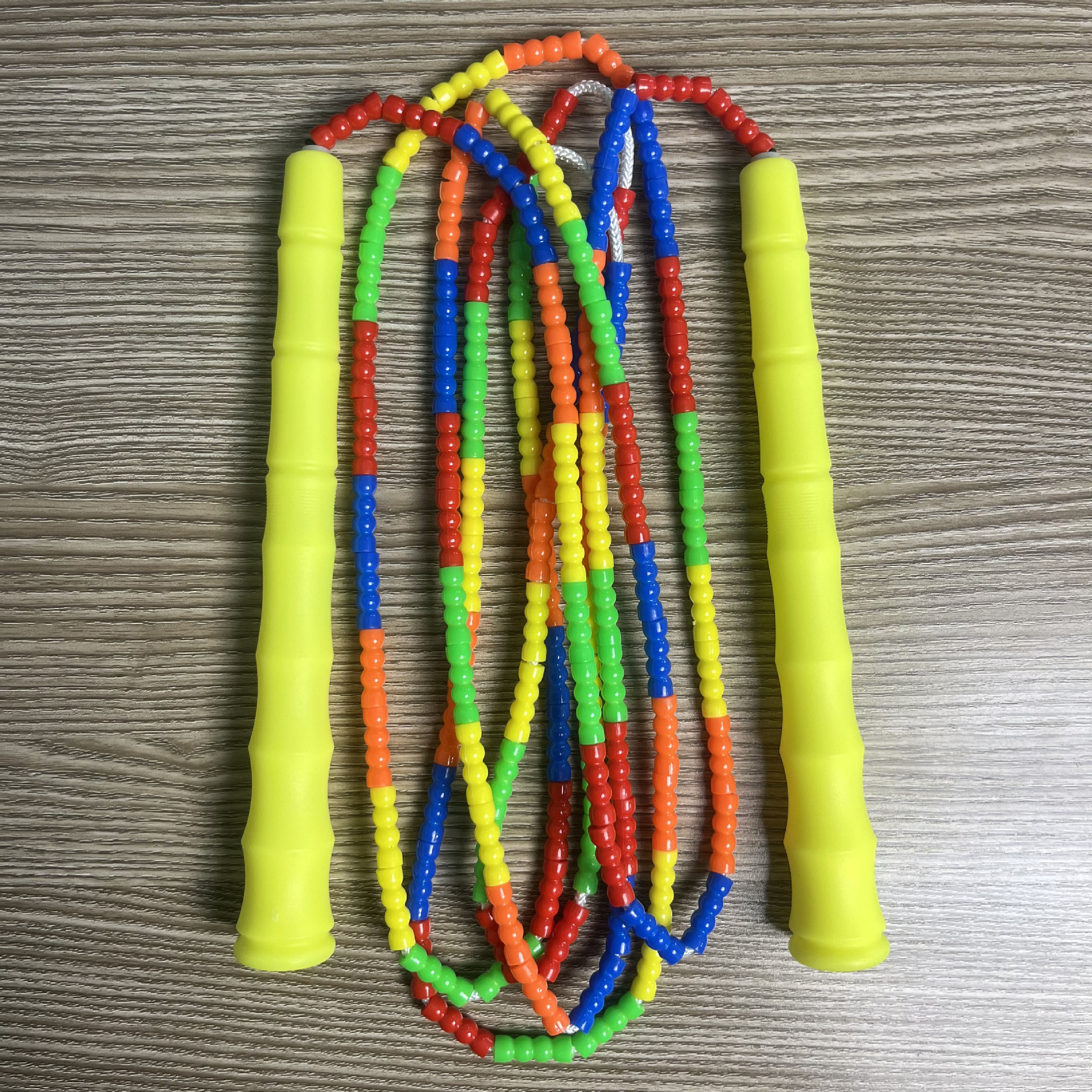 Picture of Manufacturer Wholesale Children's Fitness Sports Pattern Skipping Rope Kindergarten Competition Soft Bead Bamboo Skipping Rope for Primary School Students