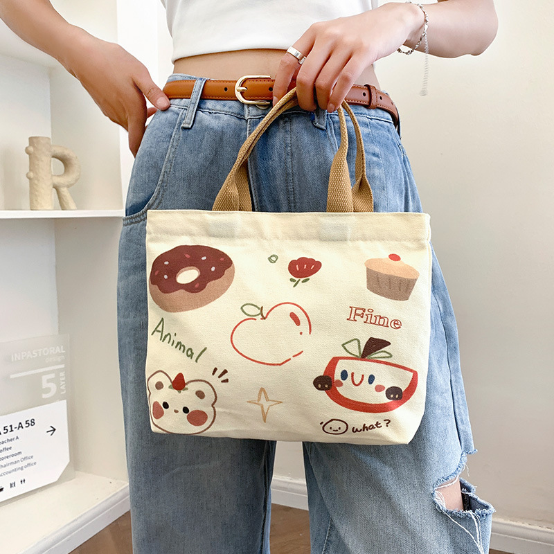 Picture of 2025 New Cute Cartoon Japanese Style Canvas Bag Tutorial Lunch Bag Manufacturer Wholesale Bag Women's Bag Handbag
