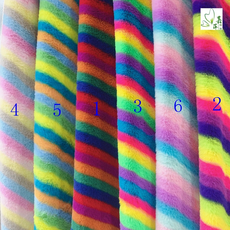 Factory spot 800 grams of small rabbit hair printed flannel polyester plush fabric printed rainbow strip fabric