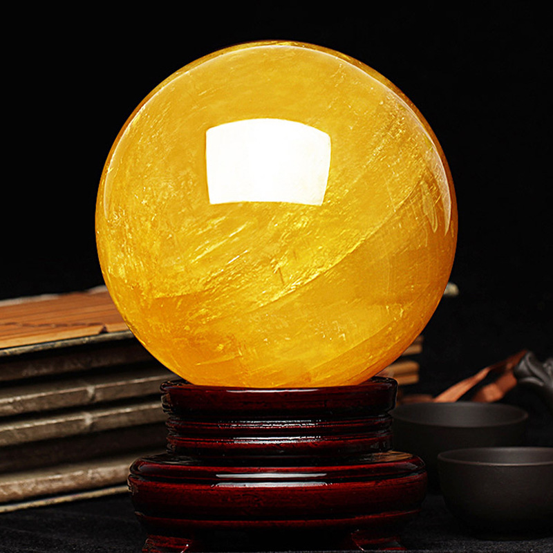 Picture of Natural yellow crystal ball ornaments yellow crystal ball original stone size a generation of direct selling gifts