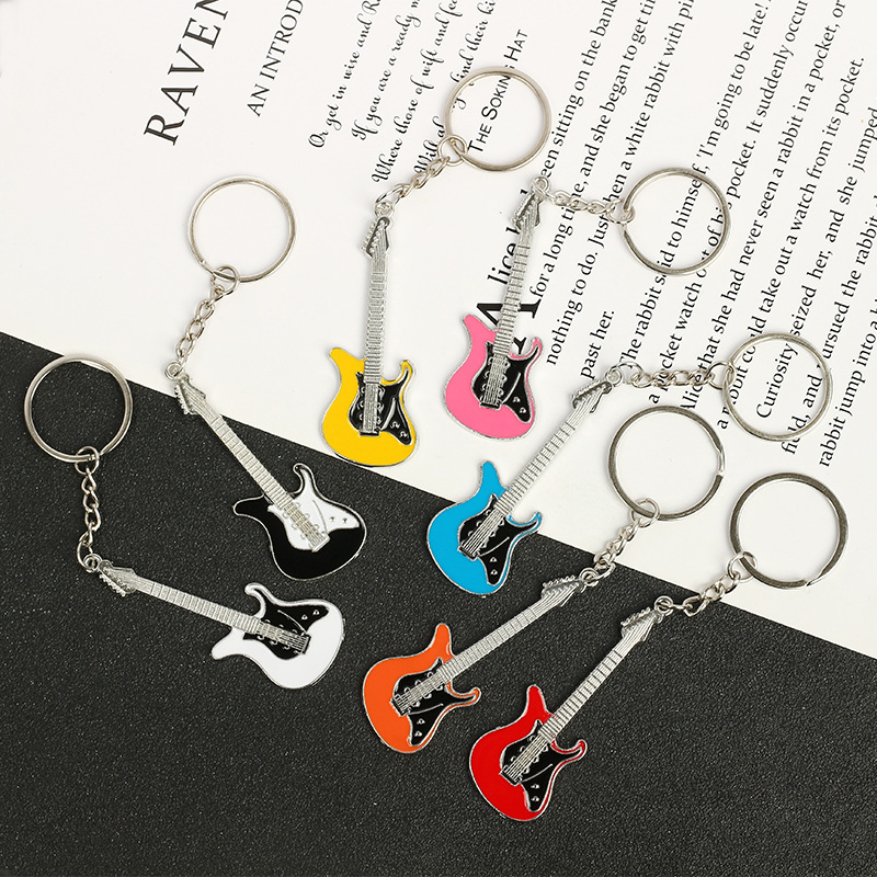 Cross-border spot wholesale creative musical instrument pendant gift bag pendant metal paint guitar keychain