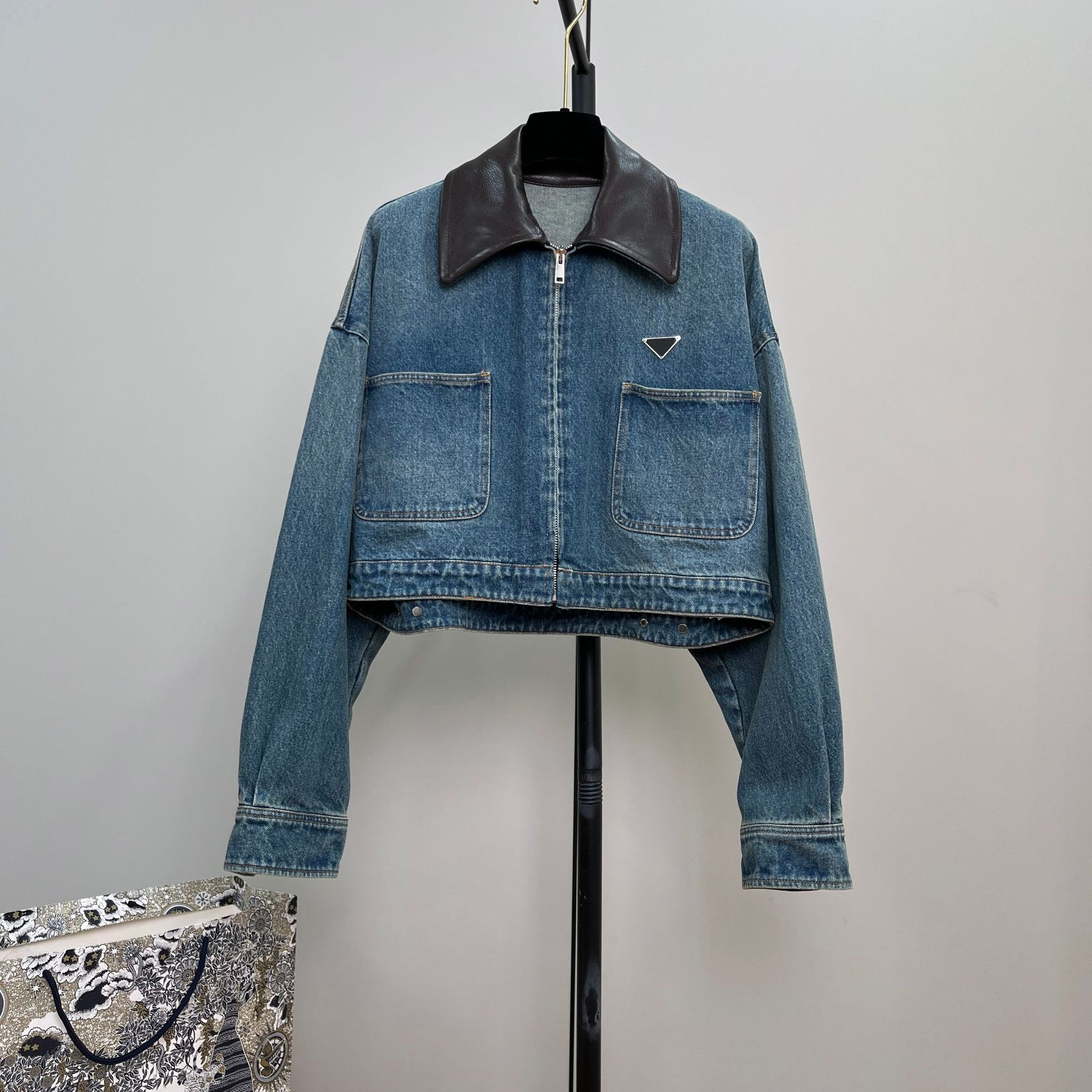 Picture of High-End Heavy-Duty Zipper Denim Jacket for Women with Chest Pocket Triangle Logo Genuine Leather Lapel Short Jacket Top